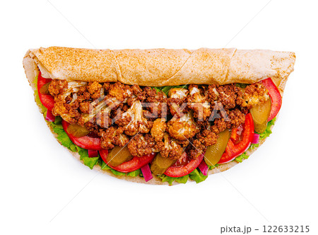 Delicious wrap filled with crispy cauliflower, fresh vegetables, and savory sauce in a whole grain tortilla Delicious wrap filled with crispy cauliflower, fresh vegetables, and savory sauce in a whole grain tortilla 122633215