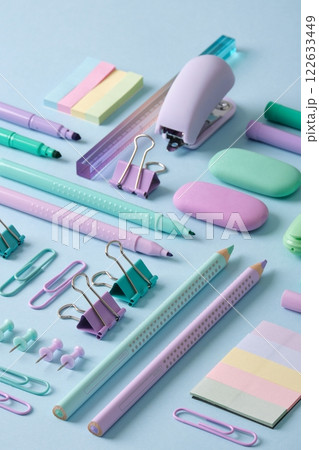 Stationery background with pastel-colored stationery neatly arranged on a light blue background. Back to school concept. 122633449