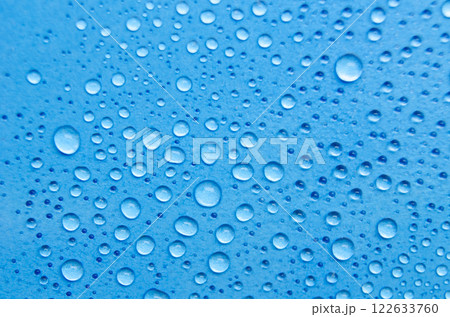 Rain water droplets with ocean blue background. Suitable for wallpaper cover design Rain water droplets with ocean blue background. Suitable for wallpaper cover design 122633760
