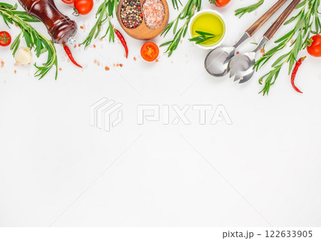 fresh herbs, spices and kitchen utensils on a white background. Cooking table. top view. copy space 122633905