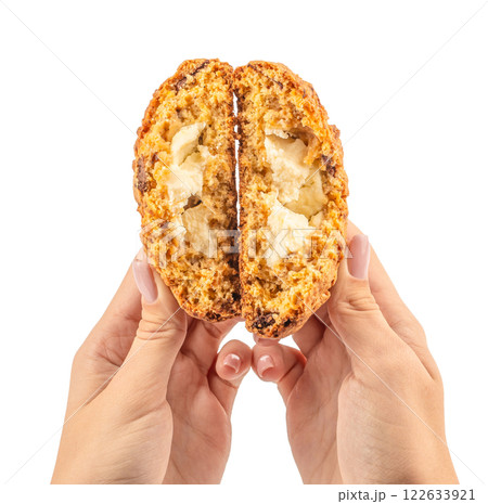 Women hands holding homemade cookie biscuits with filling isolated white background Women hands holding homemade cookie biscuits with filling isolated white background 122633921