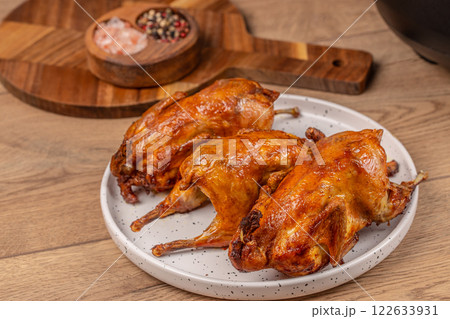 quail Baked on plate on a wooden background. top view quail Baked on plate on a wooden background. top view 122633931