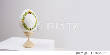 beautiful light easter layout with marble eggs, cherry blossoms and confetti on a white background. top view. copy space. flat lay. place for text 122635968