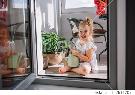 Elegant hand with colorful nails resting on a vibrant bouquet of roses 122636703