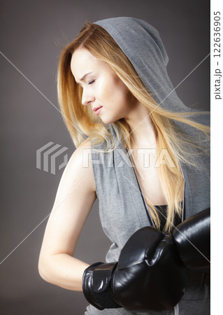 Boxer girl exercise with boxing gloves. Boxer girl exercise with boxing gloves. 122636905