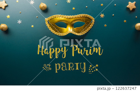 Happy Purim carnival decoration concept made from golden mask star and glitter on dark background. (Happy Purim in Hebrew, jewish holiday celebrate) 122637247