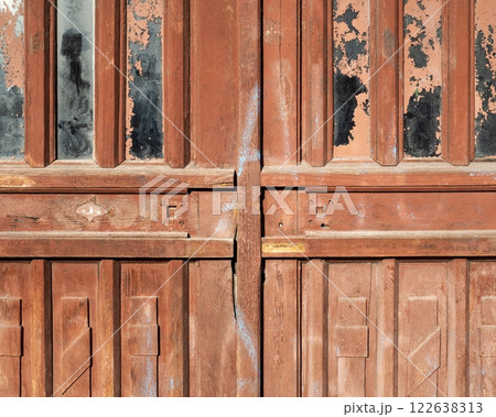 Fragment of old vintage weathered wooden doors with glazing 122638313
