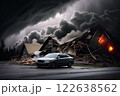 A car is in front of a destroyed house that is on fire 122638562