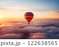 Colorful hot air balloon floats over a sea of clouds at sunset 122638565