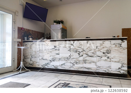 Budget hotel lobby, visitor reception desk 122638592