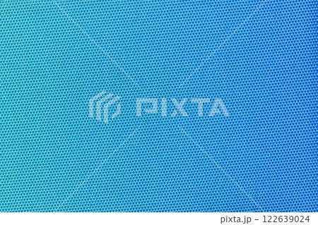 A vibrant blue fabric with a tight honeycomb pattern, creating a modern and clean texture. Ideal for use in fashion, interior design, or as a versatile background element. Blue gradient. 122639024