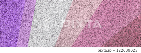 A textured abstract background featuring diagonal color stripes in shades of pink, violet, lavender, and purple with a rough surface finish, creating a vibrant and artistic visual. Long banner. A textured abstract background featuring diagonal color stripes in shades of pink, violet, lavender, and purple with a rough surface finish, creating a vibrant and artistic visual. Long banner. 122639025