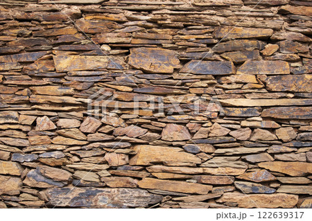Stone background - horizontally arranged naturally quarried stones 122639317
