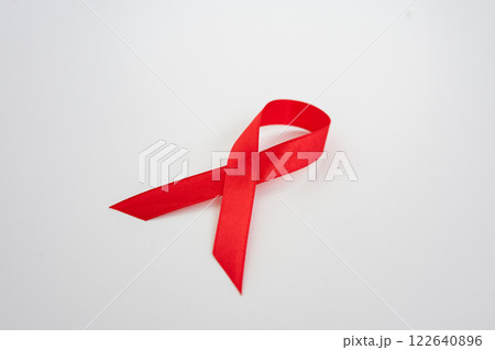 Red awareness ribbon symbol against white background. National Youth HIV and AIDS Awareness Day Red awareness ribbon symbol against white background. National Youth HIV and AIDS Awareness Day 122640896