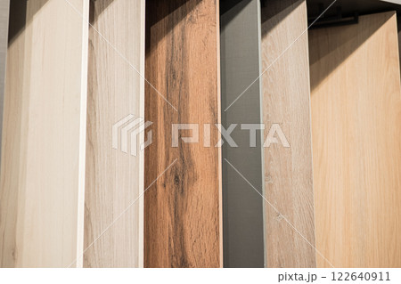 Variety of wooden laminate panels displayed in vertical arrangement Variety of wooden laminate panels displayed in vertical arrangement 122640911