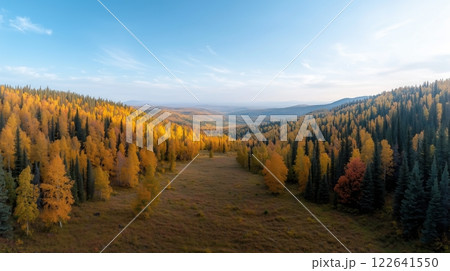 Breathtaking Panoramic View of Autumn Foliage in Mountainous Landscape at Sunrise 122641550