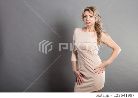 Mid aged lady with dress. 122641987