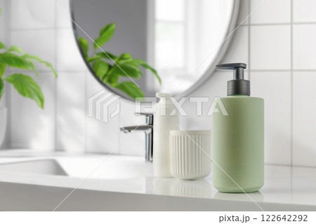 A beautifully designed modern bathroom scene showcasing stylish green soap dispenser mockup A beautifully designed modern bathroom scene showcasing stylish green soap dispenser mockup 122642292