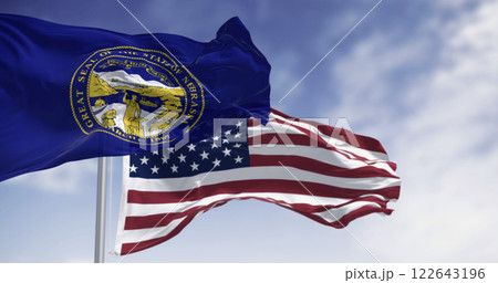 Nebraska state flag waving with the American flag in background Nebraska state flag waving with the American flag in background 122643196