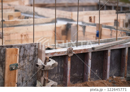 Construction of pile-grillage foundation. Monolithic foundation with metal reinforcement. Monolithic concrete foundation. House construction 122645771