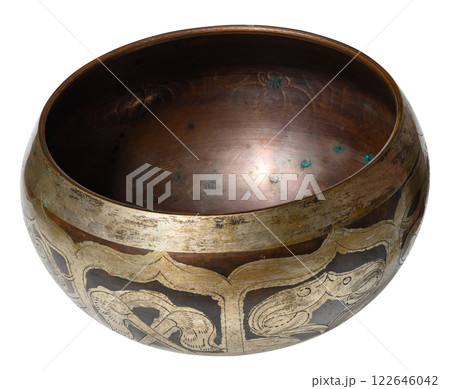 Copper singing bowl for meditation and relaxation on isolated background 122646042