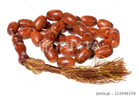 Stone rosary beads with tassel for counting mantras on isolated background Stone rosary beads with tassel for counting mantras on isolated background 122646159