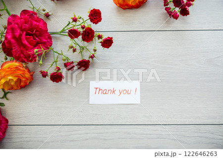 wooden light background with white and pink roses 122646263