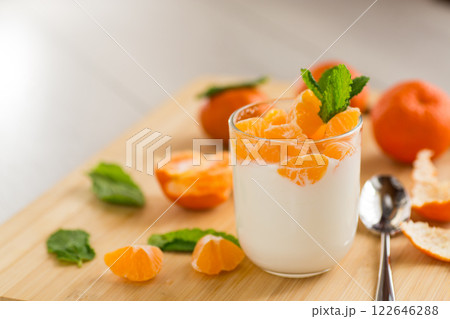 Refreshing dessert with tangerines and yogurt Refreshing dessert with tangerines and yogurt 122646288