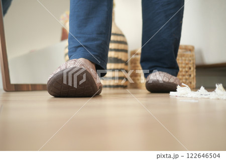 man in soft slippers at home 122646504
