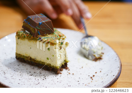 A Slice of Delicious Cheesecake Topped Generously with Chocolate A Slice of Delicious Cheesecake Topped Generously with Chocolate 122646623