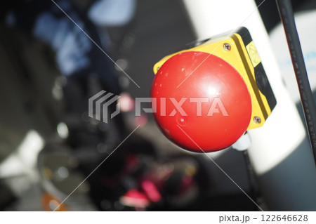 Bright red emergency button on a city street 122646628