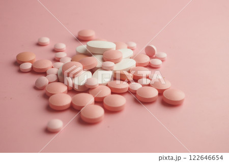 Close-Up of Pink Tablets on a Soft Surface Close-Up of Pink Tablets on a Soft Surface 122646654