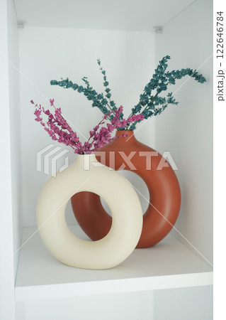 Beautiful and Elegant Flower Vases, adorned with Decorative Foliage 122646784