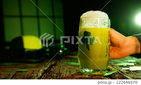 Frosty green beer in a festive pub 122646870