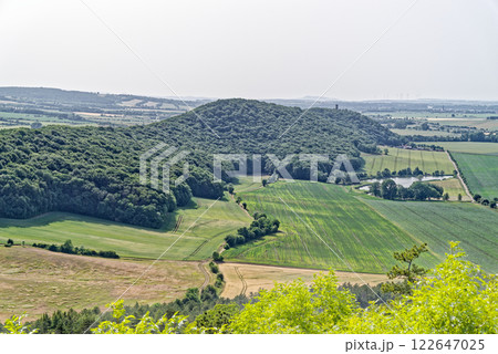 Breathtaking View of the Lush Hills and Expansive Fields in a Sunny Landscape.  122647025