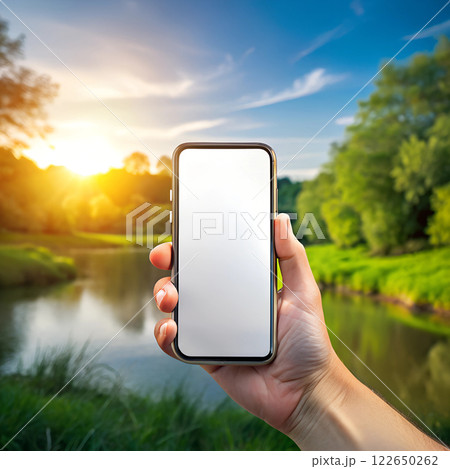 Hand Holding Blank Smartphone Screen in Natural Landscape Hand Holding Blank Smartphone Screen in Natural Landscape 122650262