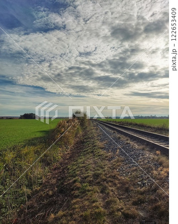 Railway line among sown fields Railway line among sown fields 122653409