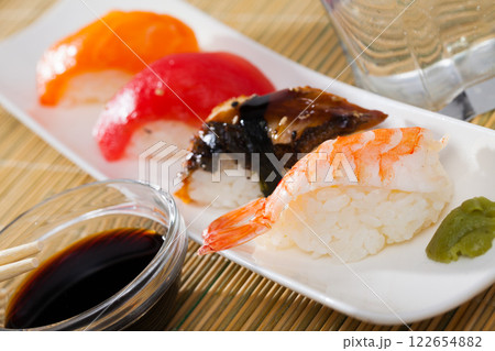 Nigiri with fresh salmon, tuna, eel and shrimp 122654882