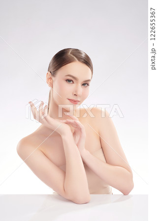 Beautiful young woman with clean fresh skin on white background, Face care, Facial treatment, Cosmetology, beauty and spa, women portrait. Beautiful young woman with clean fresh skin on white background, Face care, Facial treatment, Cosmetology, beauty and spa, women portrait. 122655367