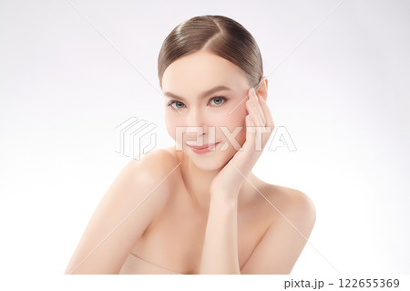 Beautiful young woman with clean fresh skin on white background, Face care, Facial treatment, Cosmetology, beauty and spa, women portrait. Beautiful young woman with clean fresh skin on white background, Face care, Facial treatment, Cosmetology, beauty and spa, women portrait. 122655369