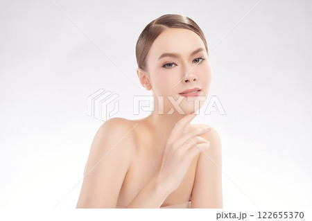 Beautiful young woman with clean fresh skin on white background, Face care, Facial treatment, Cosmetology, beauty and spa, women portrait. Beautiful young woman with clean fresh skin on white background, Face care, Facial treatment, Cosmetology, beauty and spa, women portrait. 122655370