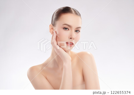 Beautiful young woman with clean fresh skin on white background, Face care, Facial treatment, Cosmetology, beauty and spa, women portrait. Beautiful young woman with clean fresh skin on white background, Face care, Facial treatment, Cosmetology, beauty and spa, women portrait. 122655374