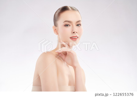 Beautiful young woman with clean fresh skin on white background, Face care, Facial treatment, Cosmetology, beauty and spa, women portrait. 122655376