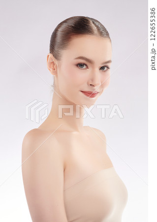 Beautiful young woman with clean fresh skin on white background, Face care, Facial treatment, Cosmetology, beauty and spa, women portrait. Beautiful young woman with clean fresh skin on white background, Face care, Facial treatment, Cosmetology, beauty and spa, women portrait. 122655386