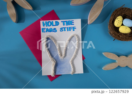Handmade greeting card in colorful envelope letter with humor message HOLD THE EARS STIFF written in beautiful handwriting. Gesture shows excitement and joy for the upcoming event. Springtime holiday Handmade greeting card in colorful envelope letter with humor message HOLD THE EARS STIFF written in beautiful handwriting. Gesture shows excitement and joy for the upcoming event. Springtime holiday 122657929