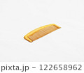A wooden comb on a white background with copy space 122658962