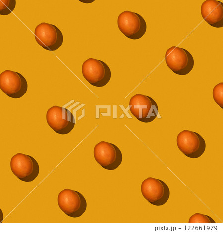 Fresh juicy whole orange on yellow background. Fruit pattern, summer concept. Flat lay Top view. Background with citrus fruits 122661979
