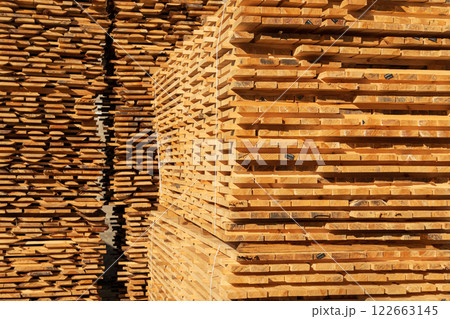 Pile of pine boards. Wood drying. Lumber. Harvesting, sale of lumber for construction 122663145
