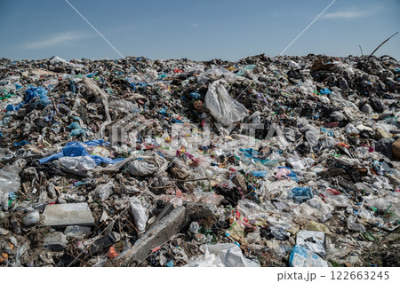 A lot of garbage in the landfill. An open-air landfill. Polyethylene and a lot of different garbage A lot of garbage in the landfill. An open-air landfill. Polyethylene and a lot of different garbage 122663245