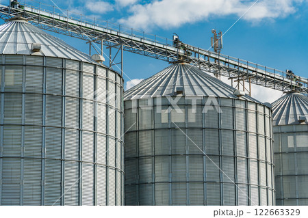 Modern steel agricultural grain granary silos. Agricultural warehouse. Agro industry 122663329